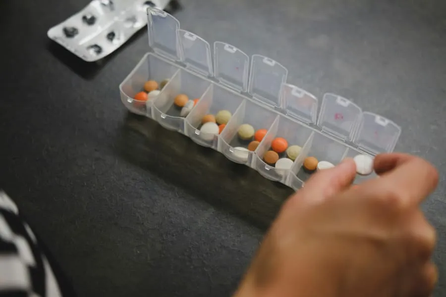 A weekly pill organiser filled with prescribed medication